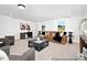This living room features large windows, neutral carpet, and a modern decor at 140 Summer Mist Ln # 159, Clayton, NC 27527