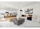 Spacious open-concept living room with a modern kitchen in the background and stylish furniture arrangement at 140 Summer Mist Ln # 159, Clayton, NC 27527