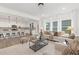 Open-concept layout showcasing the seamless transition from the living room to the modern kitchen at 140 Summer Mist Ln # 159, Clayton, NC 27527