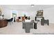 This living room features large windows, neutral carpet, and modern decor throughout the room at 140 Summer Mist Ln # 159, Clayton, NC 27527