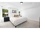 Comfortable main bedroom with a tray ceiling, neutral decor, lots of natural light, and simple but elegant style at 140 Summer Mist Ln # 159, Clayton, NC 27527