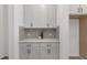 Pantry featuring stylish gray cabinetry and quartz countertops at 140 Summer Mist Ln # 159, Clayton, NC 27527