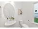Modern powder room with pedestal sink and designer accents at 140 Summer Mist Ln # 159, Clayton, NC 27527