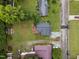 Bird's-eye view of a residential neighborhood with well-kept lawns, tree-lined streets, and orderly arranged houses at 1416 Chestnut St, Roxboro, NC 27573