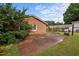A well-manicured backyard featuring a concrete patio and grill at 1416 Chestnut St, Roxboro, NC 27573