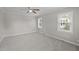 Neutral bedroom with new carpeting and plenty of natural light from two windows at 1416 Chestnut St, Roxboro, NC 27573