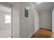 A hallway featuring hardwood-style floors, neutral-painted walls and white molding at 1416 Chestnut St, Roxboro, NC 27573