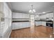 Spacious kitchen with ample cabinet space, wood-look floors and updated appliances at 1416 Chestnut St, Roxboro, NC 27573