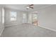 Inviting living room filled with natural light and neutral carpeting at 1416 Chestnut St, Roxboro, NC 27573