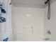 A clean shower and tub with an adjustable shower head at 1416 Chestnut St, Roxboro, NC 27573