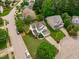 Aerial view of home nestled among tree-lined streets in quiet suburban neighborhood at 1514 Hinchliff Ct, Fuquay Varina, NC 27526