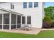 Backyard with brick patio and a view of the home's exterior at 1514 Hinchliff Ct, Fuquay Varina, NC 27526