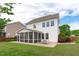 Spacious backyard featuring a screened-in porch and brick patio at 1514 Hinchliff Ct, Fuquay Varina, NC 27526