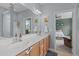 View of bathroom with double vanity and a view of the bedroom and the walk in shower at 1514 Hinchliff Ct, Fuquay Varina, NC 27526