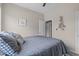 Comfortable bedroom with light gray walls, ceiling fan and cozy bed at 1514 Hinchliff Ct, Fuquay Varina, NC 27526