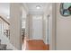 Welcoming foyer with hardwood floors, staircase, and views into adjacent rooms of the home at 1514 Hinchliff Ct, Fuquay Varina, NC 27526