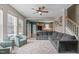 Inviting living area with a comfortable gray sectional, decorative rug, and staircase access at 1514 Hinchliff Ct, Fuquay Varina, NC 27526