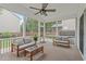 Cozy screened-in porch with comfortable seating and ceiling fan at 1514 Hinchliff Ct, Fuquay Varina, NC 27526