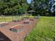Backyard garden with raised beds, perfect for growing vegetables and herbs at 154 Hillsdale Dr, Archer Lodge, NC 27527