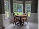 Charming breakfast nook featuring natural lighting and updated flooring at 154 Hillsdale Dr, Archer Lodge, NC 27527