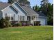 Charming home featuring a well-manicured lawn, attached garage, and delightful front porch at 154 Hillsdale Dr, Archer Lodge, NC 27527
