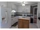 Well-lit kitchen boasting white cabinetry, updated countertops, and a decorative island at 154 Hillsdale Dr, Archer Lodge, NC 27527