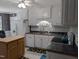 Well-lit kitchen boasting white cabinetry, updated countertops, and decorative backsplash at 154 Hillsdale Dr, Archer Lodge, NC 27527