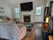Inviting living room featuring a fireplace, TV, and comfortable seating at 154 Hillsdale Dr, Archer Lodge, NC 27527