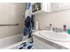 Compact bathroom featuring a vanity sink, a toilet and tub combination, and grab bars at 1709 Whitfield Ave, Rocky Mount, NC 27801