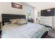 Spacious bedroom with a decorative bed, matching nightstands, and ample storage space at 1709 Whitfield Ave, Rocky Mount, NC 27801