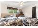 Bright bedroom features two beds, a window, and a traditional dresser at 1709 Whitfield Ave, Rocky Mount, NC 27801