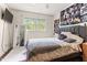 Cozy bedroom with a comfy bed and window view and eclectic decor at 1709 Whitfield Ave, Rocky Mount, NC 27801