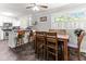 Cozy dining area features a wooden table set next to a kitchen bar and window views at 1709 Whitfield Ave, Rocky Mount, NC 27801