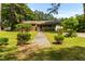 Brick home with a front porch, featuring manicured shrubs and a walkway at 1709 Whitfield Ave, Rocky Mount, NC 27801