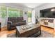 Spacious living room highlighting a large window and comfortable seating arrangement at 1709 Whitfield Ave, Rocky Mount, NC 27801