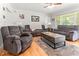 Inviting living room showcasing hardwood floors, a ceiling fan, and ample seating at 1709 Whitfield Ave, Rocky Mount, NC 27801