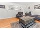Comfortable living room featuring hardwood floors, plush seating, and neutral decor at 1709 Whitfield Ave, Rocky Mount, NC 27801