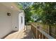 The backyard deck is perfect for relaxation and entertainment with backyard access and a wooden railing at 1812 Hilton St, Raleigh, NC 27608