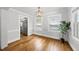 Elegant dining room with hardwood floors, light fixture and a neutral color palette at 1812 Hilton St, Raleigh, NC 27608