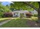 Charming home featuring a quaint porch, well-manicured landscaping, and inviting curb appeal at 1812 Hilton St, Raleigh, NC 27608