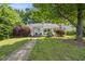 Charming home featuring a quaint porch, well-manicured landscaping, and inviting curb appeal at 1812 Hilton St, Raleigh, NC 27608