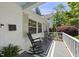 Inviting front porch with rocking chairs, perfect for relaxing and enjoying the outdoors at 1812 Hilton St, Raleigh, NC 27608