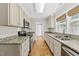 Modern kitchen with stainless steel appliances, granite countertops, and ample cabinet space at 1812 Hilton St, Raleigh, NC 27608