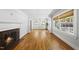 Bright living room featuring a cozy fireplace and gleaming hardwood floors at 1812 Hilton St, Raleigh, NC 27608