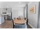 Spacious dining room showcases modern decor, a large table, and direct access to the kitchen at 1924 Fishamble # 23, Fuquay Varina, NC 27526