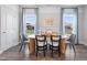 Elegant dining room featuring a stylish table with seating for six, complemented by soft natural light at 1924 Fishamble # 23, Fuquay Varina, NC 27526