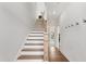 Inviting entryway featuring hardwood floors, a staircase with wooden accents, and neutral-toned walls at 1924 Fishamble # 23, Fuquay Varina, NC 27526