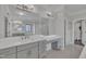 Spacious bathroom showcasing double sinks, granite countertops, and a walk-in shower at 2004 Yamacraw Dr, Knightdale, NC 27545