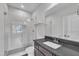 Modern bathroom with a glass shower, dark counter, and a sleek design at 2004 Yamacraw Dr, Knightdale, NC 27545