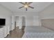 Comfortable bedroom featuring dark wood floors, neutral tones, and a ceiling fan at 2004 Yamacraw Dr, Knightdale, NC 27545